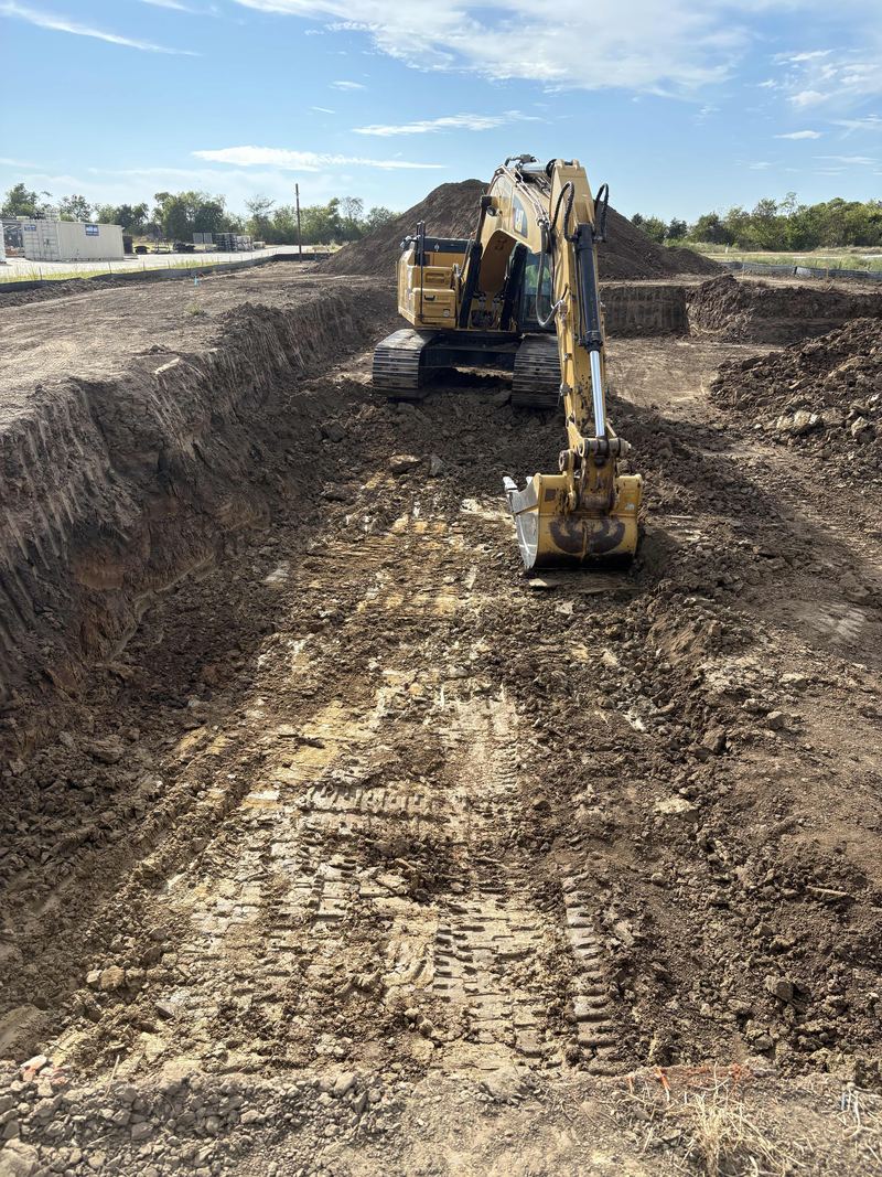 Excavator in a deep cut